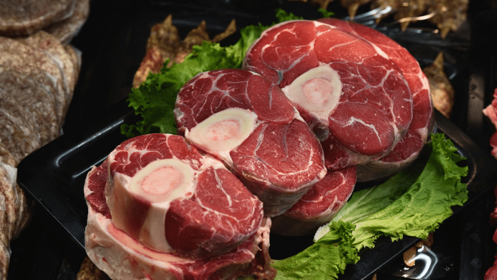 meat is displayed on a tray in a grocery store