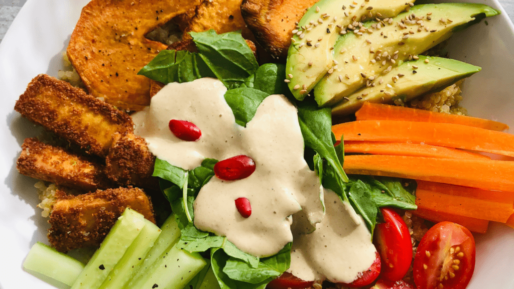 a bowl filled with vegetables and dressing