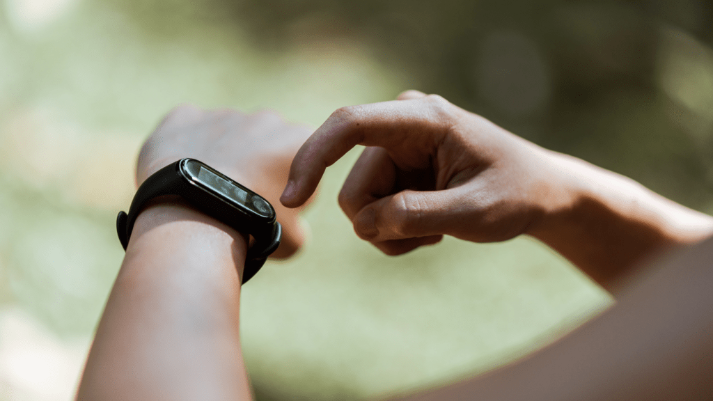 a person wearing a smart watch on their wrist