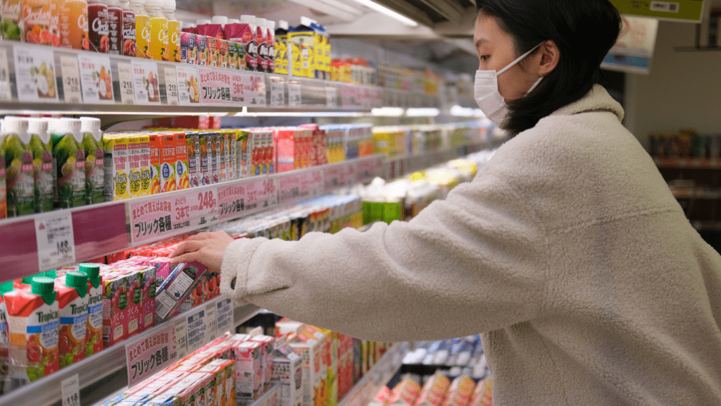 a person wearing a face mask in a grocery store