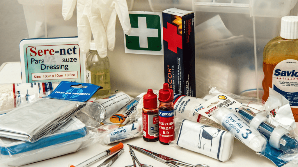 an assortment of first aid supplies laid out on a table