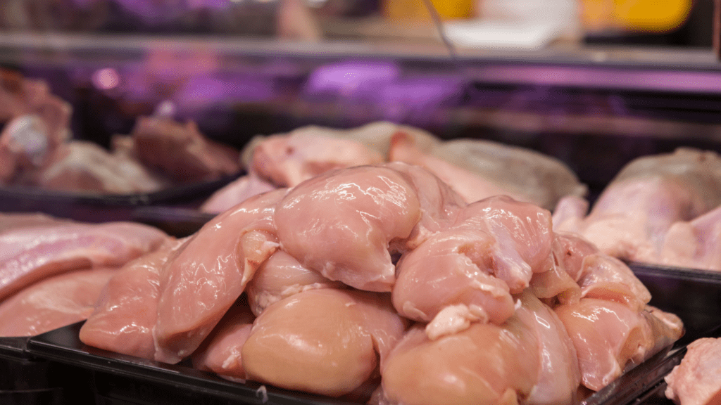 meat is displayed on a tray in a grocery store